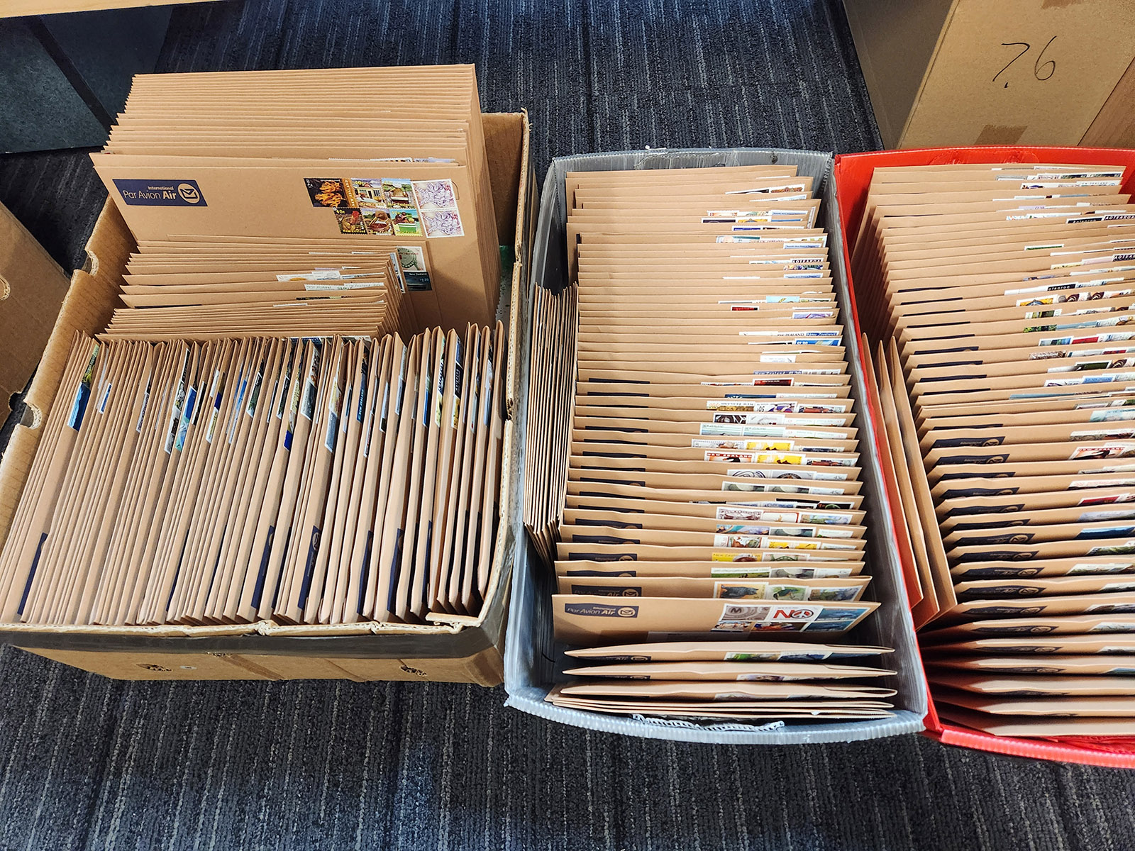 Large number of craft subscription envelopes packed by hand